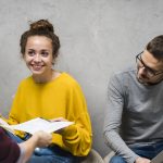 close-up-smiley-people-studying-together-indoors